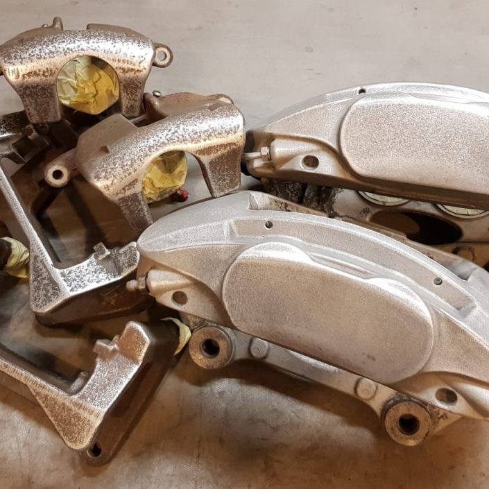 bare metal strip and shotblast of brake calipers