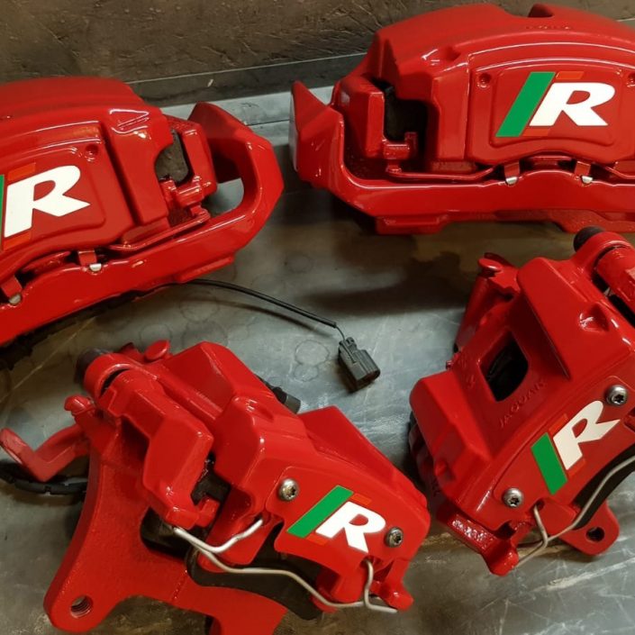 Jaguar XJR brake calipers after a full refurb in gloss red with decals